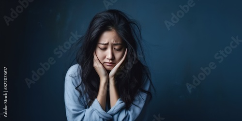 Indigo background sad Asian Woman Portrait of young beautiful bad mood expression Woman Isolated on Background depression anxiety fear burn out health issue problem mental 