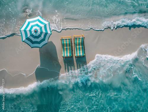 Two beach chairs and an umbrella on sandy shore with waves in the background. Aerial view. Beach vacation concept. Generative AI