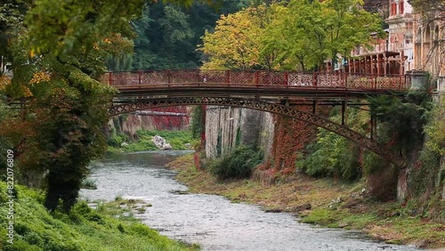 Podul de Fonta (the Cast Iron Bridge) on River Cerna on a cloudy day in Baile Herculane, Romania photo