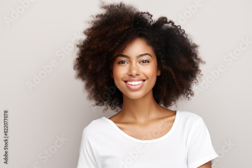 Ivory background Happy black independant powerful Woman Portrait of young beautiful Smiling girl good mood Isolated on Background Skin Care Face Beauty Product 