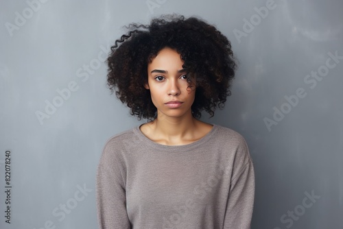 Ivory background sad black independent powerful Woman. Portrait of young beautiful bad mood expression girl Isolated on Background racism skin color depression anxiety fear burn out 