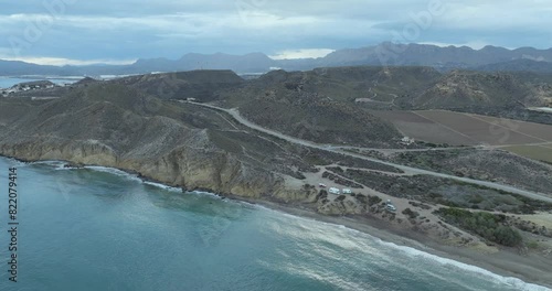 Aerial view of coastline, mountains, sea, and road at Bay de los Taray, Pulpi, Andalusia, Spain. photo