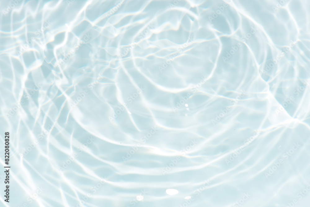 Blue water with ripples on the surface. Defocus blurred transparent blue colored clear calm water surface texture with splashes and bubbles. Water waves with shining pattern texture background. Blue water with ripples on the surface. Defocus blurred transparent blue colored clear calm water surface texture with splashes and bubbles. Water waves with shining pattern texture background.