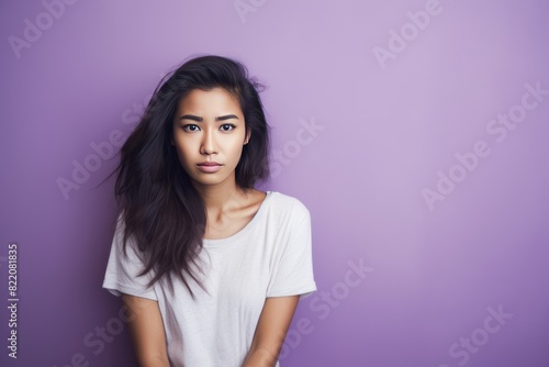 Lavender background sad Asian Woman Portrait of young beautiful bad mood expression Woman Isolated on Background depression anxiety fear burn out health issue problem mental