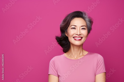 Magenta Background Happy Asian Woman Portrait of Beautiful Older Mid Aged Mature Smiling Woman good mood Isolated Anti-aging Skin Care Face Beauty Product Banner with copyspace