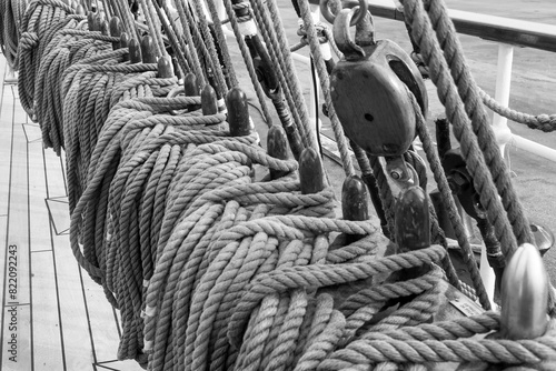 Sailboat sail ropes. Naval ropes. Black and white image.  photo