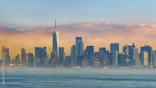 Panorama view of New York city eith statue of liberty tomorrow morning at sunrise. View from Staten Island. Big art Panorama.