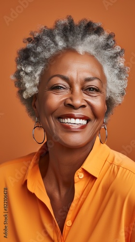 Orange background sad black independent powerful Woman. Portrait of young beautiful bad mood expression girl Isolated on Background racism skin color depression anxiety fear burn out © Zickert