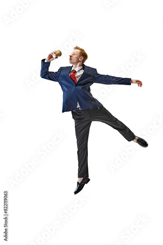 Coffee break. Young man in business attire shows his flexibility against white studio background. Work process. Concept of business, work and study, hobby, freelance, office. Ad