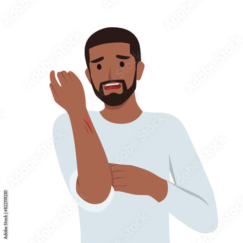 Man examines hand with deep cut or wound. Flat vector illustration isolated on white background