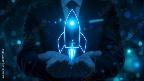 A person in a suit holding a glowing blue rocket, symbolizing innovation, technology, and futuristic advancements in business. photo