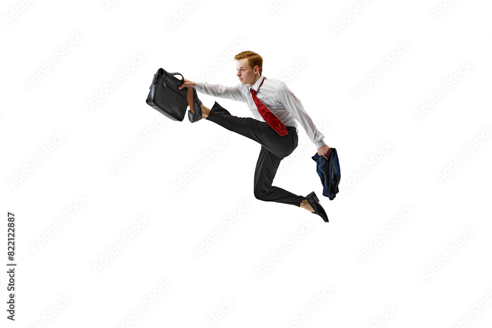 Stylish dressed man performs dynamic leap holding briefcase against white studio background. Dynamic movement of today's professional world. Concept of business, work and study, freelance, office. Ad