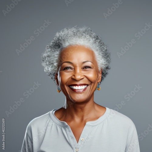 Silver Background Happy black american independant powerful Woman realistic person portrait of older mid aged person beautiful Smiling girl Isolated on Background ethnic diversity © Zickert