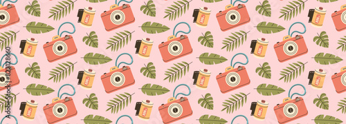 Camera and camera roll pattern. Travel stuff with tropical leaves background