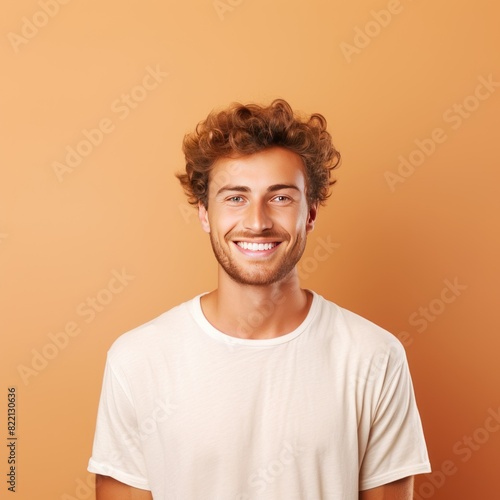 Tan background Happy european white man realistic person portrait of young beautiful Smiling man good mood Isolated on Background Banner with copyspace blank empty copy space © Zickert