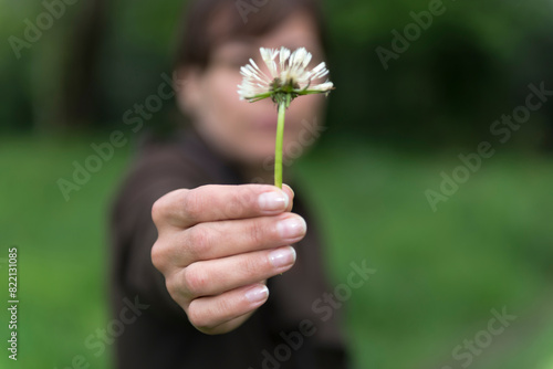 Woman Hand Holding a Dandelion Flower in Switzerland.