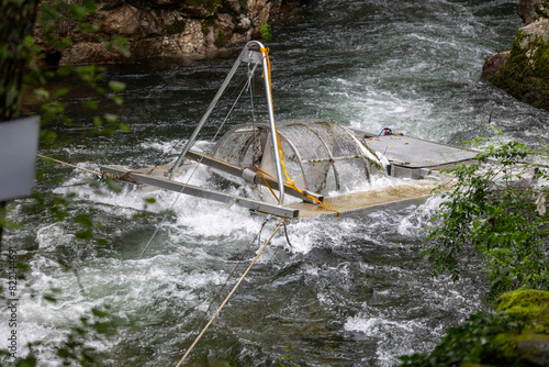 Hydroelectric turbine in the river generating electricity photo