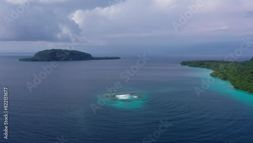 Drone top video of emerald reef in turquoise sea. Soothing ocean landscape. Sanma, Vanuatu. Tourism.