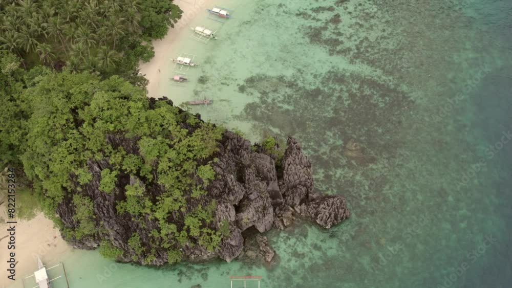 Aerial view of Cudugnon Cave with rock formations and crystal clear water, El Nido, Palawan, Philippines. Aerial view of Cudugnon Cave with rock formations and crystal clear water, El Nido, Palawan, Philippines.