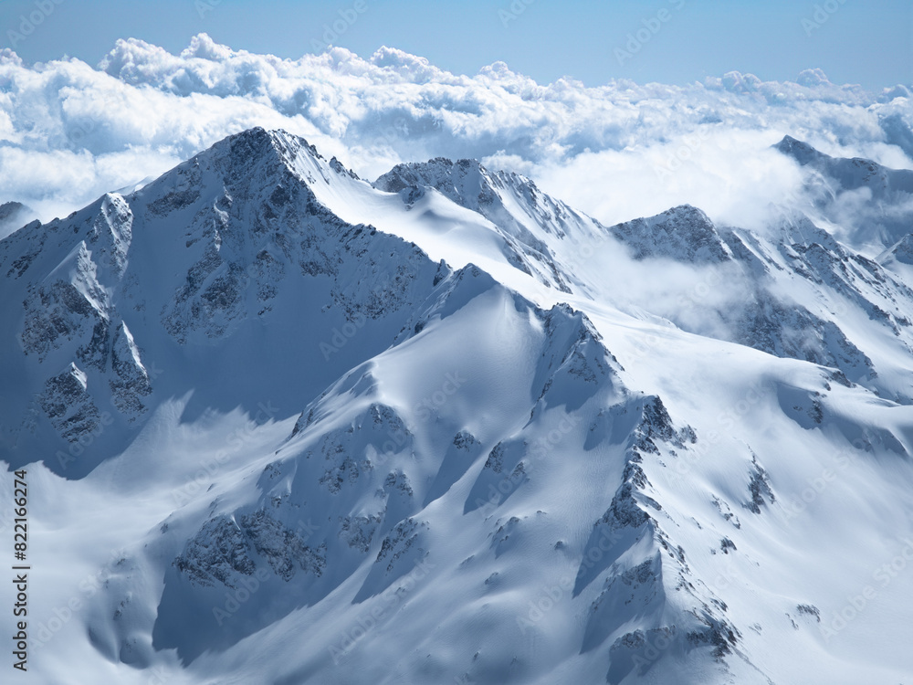 Fototapeta premium Snow capped peaks of the Greater Caucasus Mountains