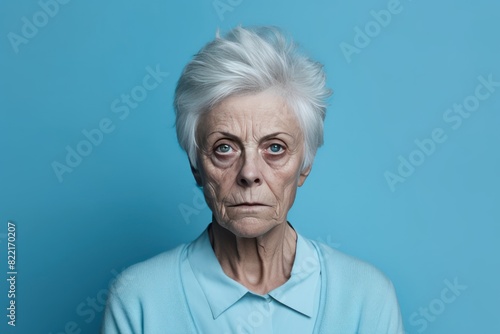 Azure background sad black American independent powerful Woman. Portrait of older mid-aged person beautiful bad mood expression girl Isolated on Background racism skin color depression anxiety  © Zickert