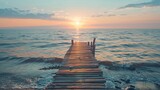 Wooden pier stretches into the sea during sunset, Wooden pier stretches out into the sea at sunset.