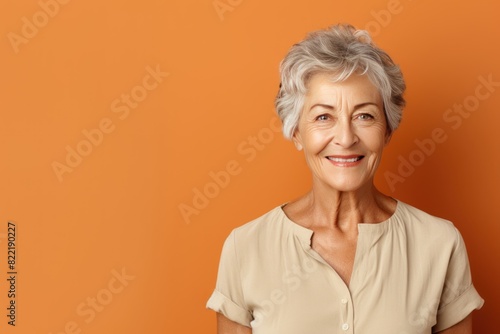 Brown background Happy european white Woman grandmother realistic person portrait of young beautiful Smiling Woman Isolated on Background Banner with copyspace 