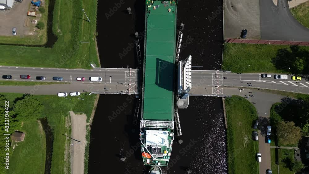 Aerial video over a river in Appingedam Netherlands on passing cargo ships Aerial video over a river in Appingedam Netherlands on passing cargo ships