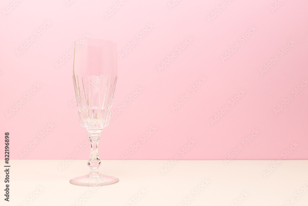 Crystal glass in front of pink background. Place for your design. Crystal glass in front of pink background. Place for your design.