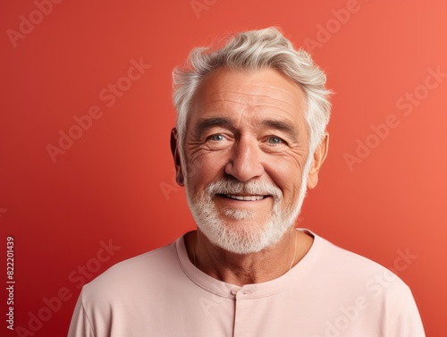 Coral background Happy european white man grandfather realistic person portrait of young beautiful Smiling old man Isolated on Background Banner with copyspace