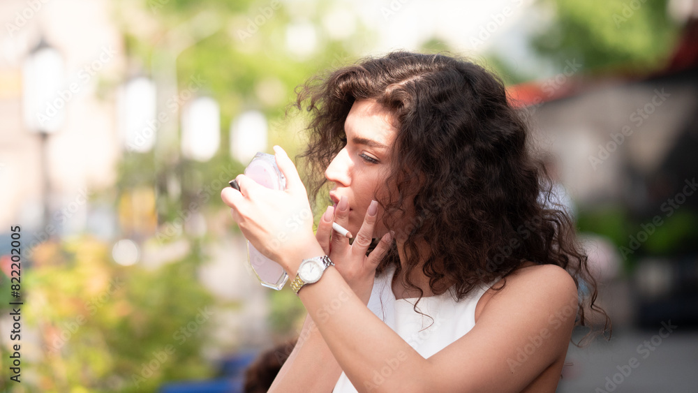 Stylish beautiful woman portrait in summer on city street Stylish beautiful woman portrait in summer on city street