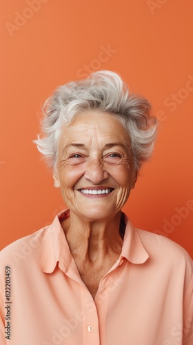Coral background Happy european white Woman grandmother realistic person portrait of young beautiful Smiling Woman Isolated on Background Banner with copyspace