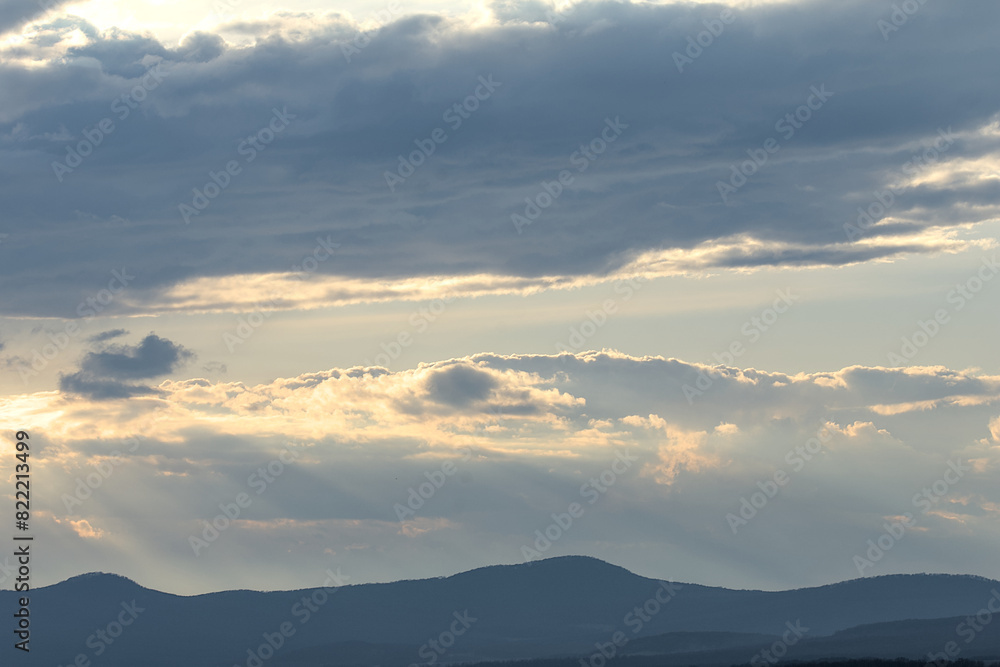 view of the hills and clouds during the day