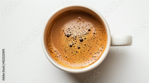 Close up of a steaming coffee cup  filled with dark coffee  set against a pristine white background. The white cup contrasts with the dark liquid  highlighting the texture and bubbles. Generative AI