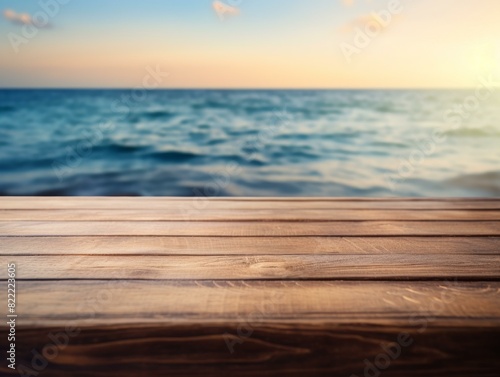 Wooden deck table top on blurred sea background for display your products