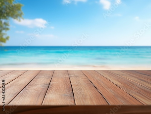 Empty wooden table top on blur beach background