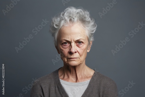 Gray background sad European white Woman grandmother realistic person portrait of young beautiful bad mood expression Woman Isolated Background © Zickert