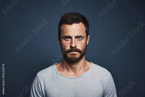 Indigo background sad european white man realistic person portrait of young beautiful bad mood expression man Isolated on Background depression anxiety 