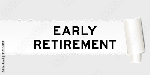 Ripped gray paper background that have word early retirement under torn part