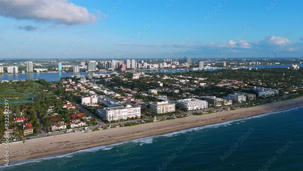 Aerial view of coastal area of Worth Avenue, Florida during daytime. Vast body of water with waves coming onto shore. Buildings amidst greenery at developed seaside area Aerial view of coastal area of Worth Avenue, Florida during daytime. Vast body of water with waves coming onto shore. Buildings amidst greenery at developed seaside area