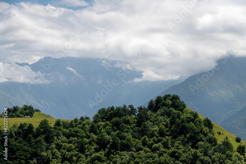 Clouds cover the peaks of the mountains. View of the Caucasus Mountains in Ingushetia  Russia