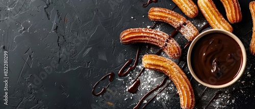 Top view of Mexican churros with chocolate sauce, using the rule of thirds, with ample copy space, sweet and crispy, high-quality image