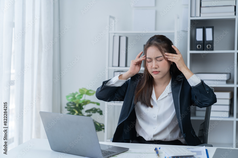 Stress at work, sitting with a stressed face, standing and stretching the body of an office woman. Stress at work, sitting with a stressed face, standing and stretching the body of an office woman.