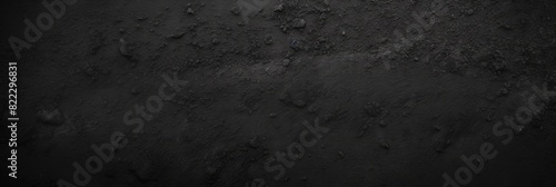  Black background,  asphalt texture with grainy surface. Black empty space for design or banner template. Dark grunge backdrop dark gray rough grainy stone or sand plaster texture 