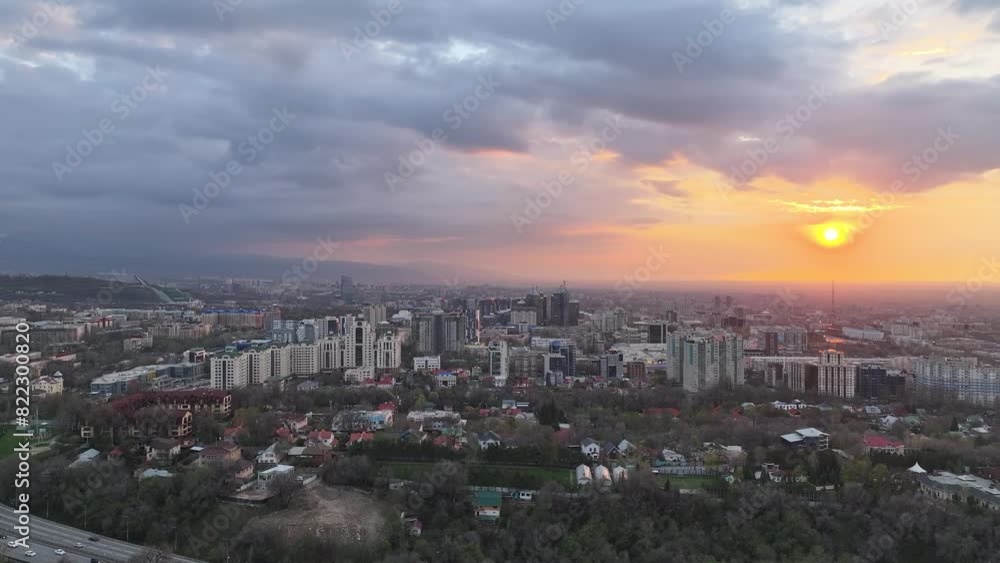 View from a quadcopter of the largest city of Kazakhstan, Almaty, on a spring evening at sunset View from a quadcopter of the largest city of Kazakhstan, Almaty, on a spring evening at sunset