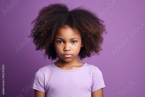 Purple background sad black American African child Portrait of young beautiful kid Isolated Background racism skin color depression anxiety fear burn out health  © Zickert