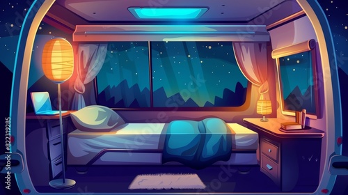 An interior of a camping trailer car with a bed and glowing floor lamp at nighttime. A desk with a laptop and jalousies in the windows. An inside view of a rv home dark bedroom with cozy sleeping photo