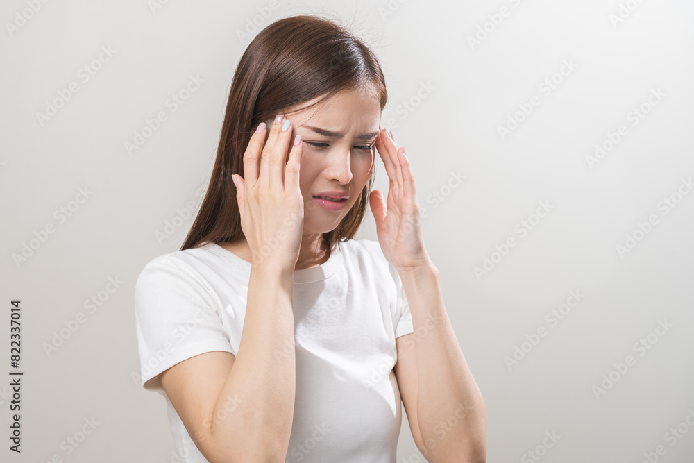 Dizzy asian young woman, girl headache or migraine pain suffering from vertigo while sitting on couch in living room at home, holding head with hand, health problem of brain or inner ear not balance. Dizzy asian young woman, girl headache or migraine pain suffering from vertigo while sitting on couch in living room at home, holding head with hand, health problem of brain or inner ear not balance.