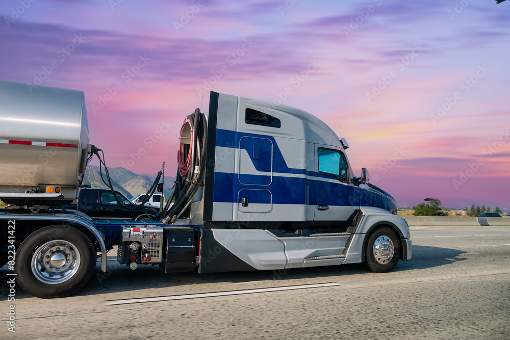 Obraz premium Truck with container on highway, cargo transportation concept in California, United States 