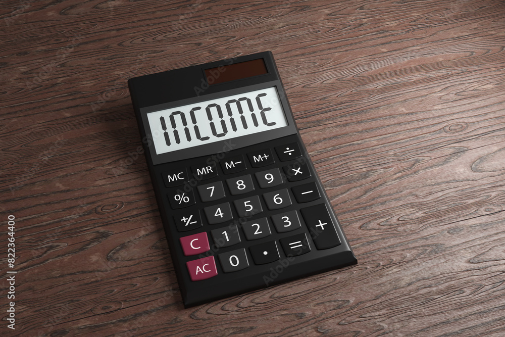 Black office calculator with its display showing the word INCOME on a wooden table. Illustration of the concept of personal earnings, employee salary and business revenue Black office calculator with its display showing the word INCOME on a wooden table. Illustration of the concept of personal earnings, employee salary and business revenue